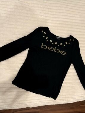 bebe Black Long-Sleeve Top with Gold Logo and Grommets